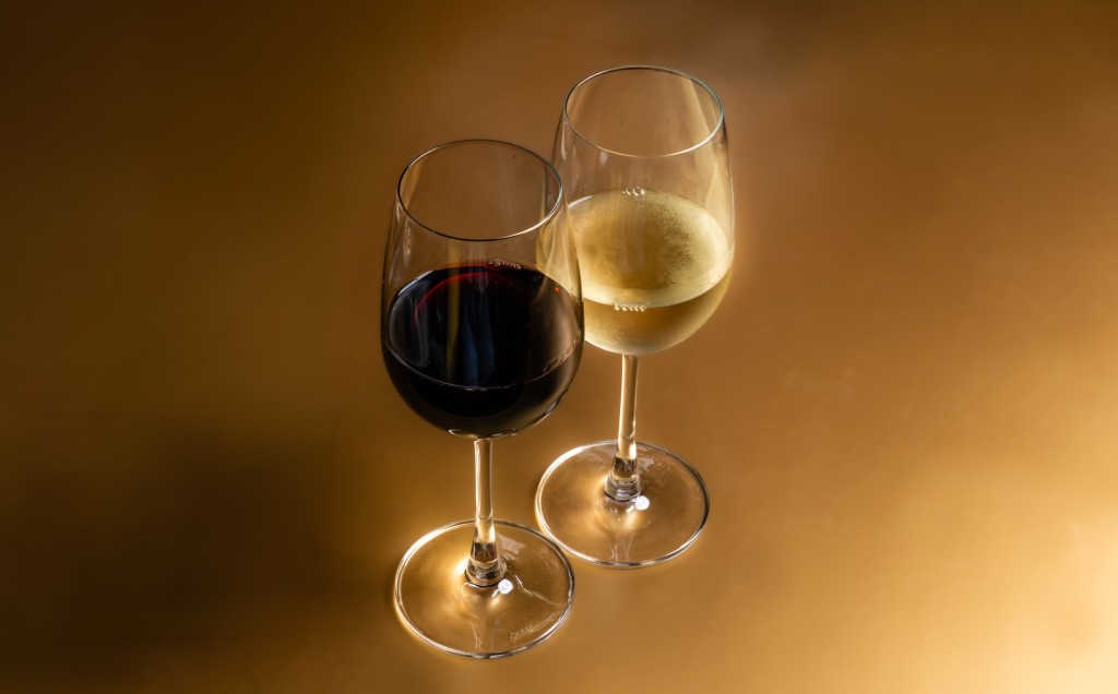 Glasses of red and white wine from the wine list at Vesu Pizza Bar in Tsim Sha Tsui, Hong Kong.